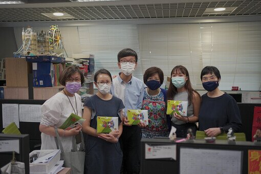 Dr. Kenneth Tse, Chairman of the Foundation, and two school Supervisors distribute the reusable face masks to College staff
