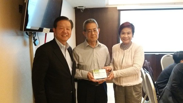 Mrs. Mabel Lee, Chairman of the Foundation, presents a thank-you plaque to Mr. Tsang