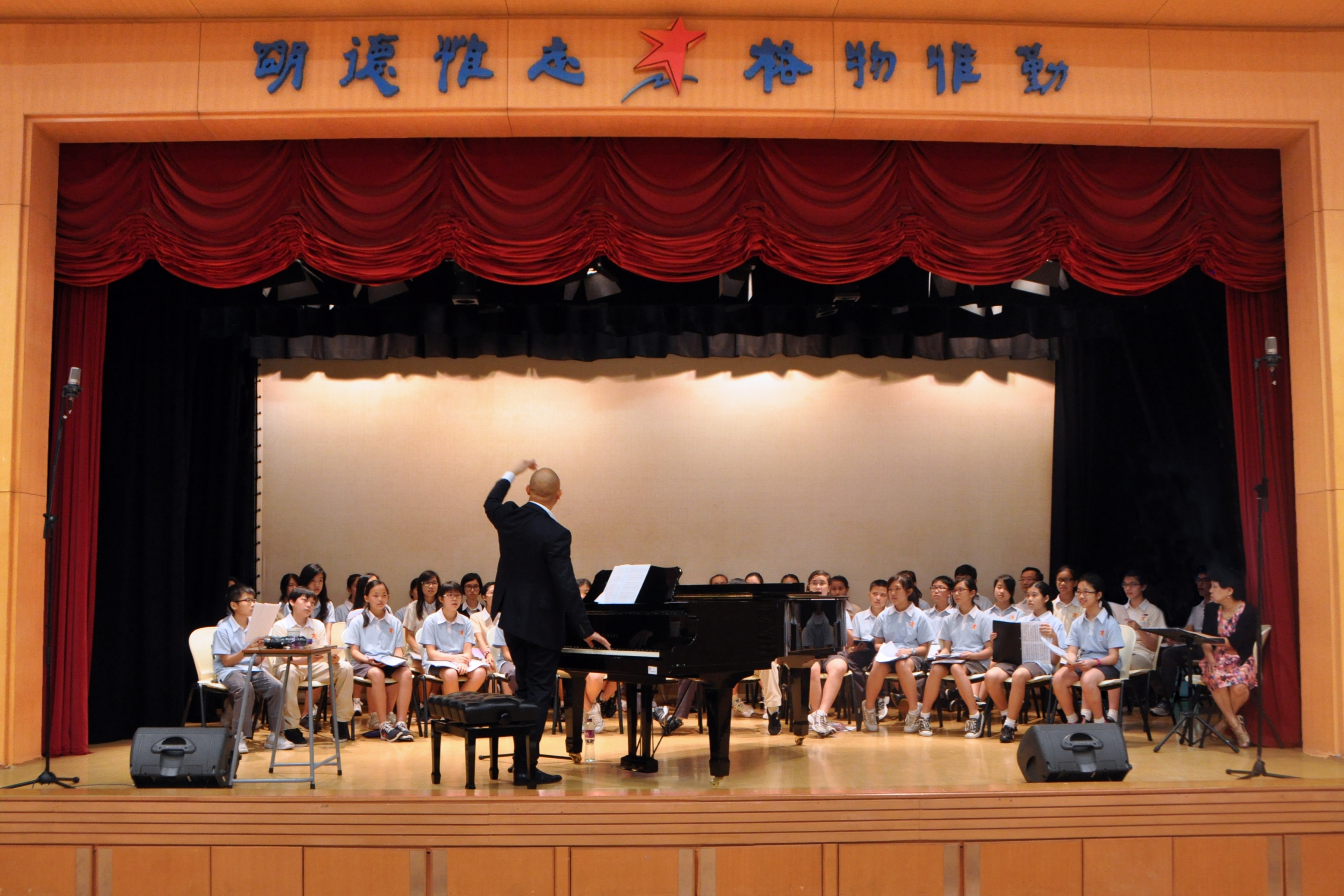 Mr. Jimmy Chiang instructing our choir members