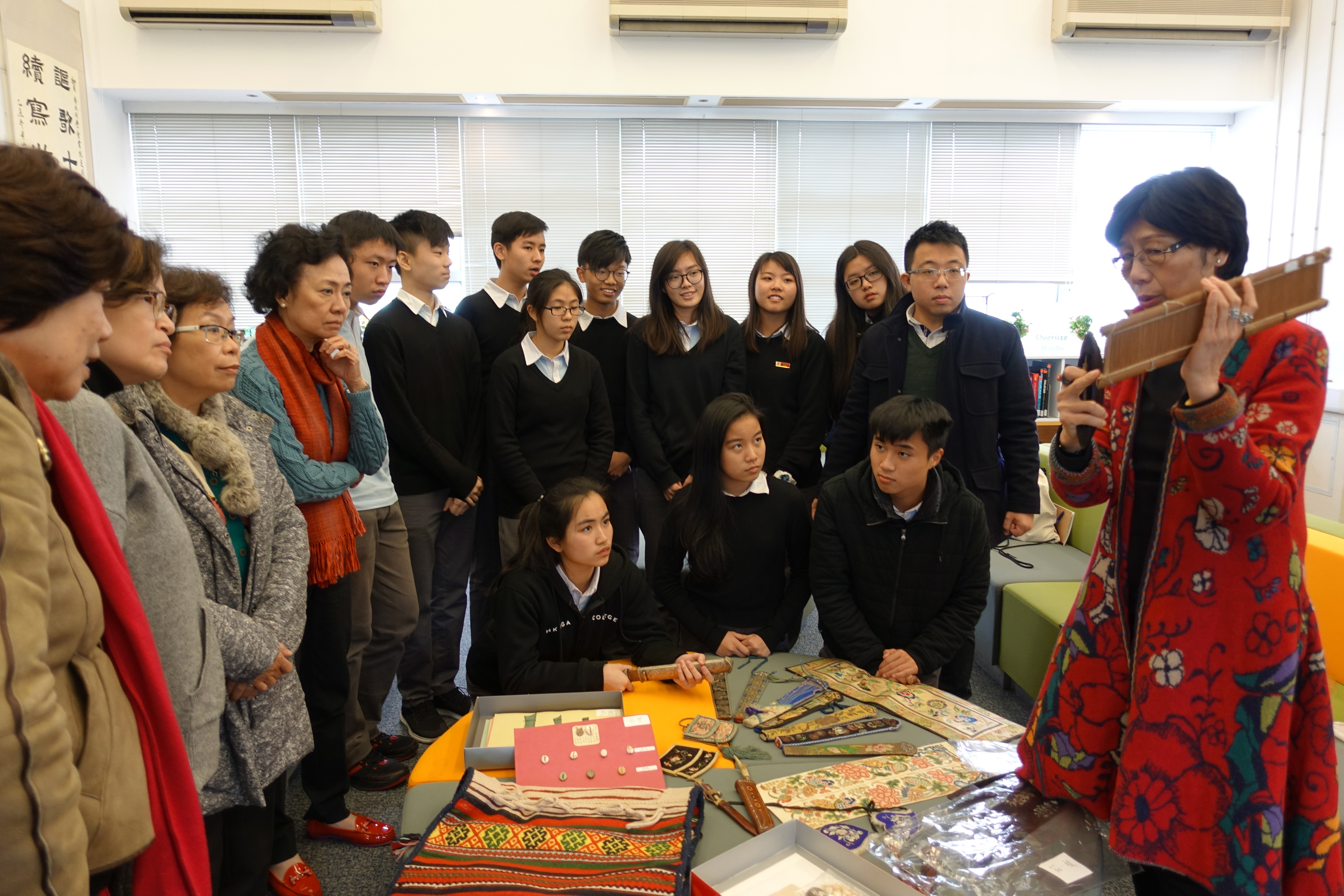 Ms. Lee Mei Yin introducing the exhibits to students